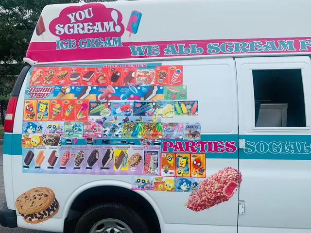 Close-up of the truck’s service window and the full menu board of treats